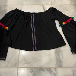 Off-the-shoulder top with fun pompon sleeve accent